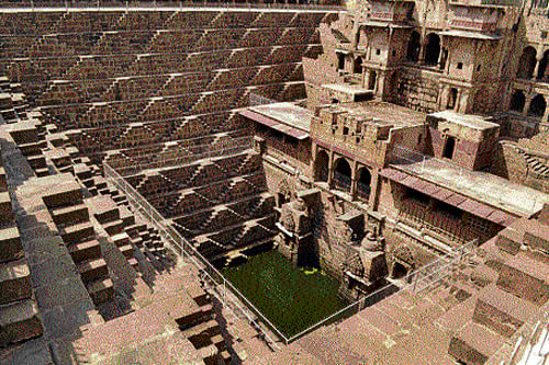 Lost relics: The Chand Baori in Abhaneri; (below) locals perform their everyday chores at the well. (Courtesy TWF)