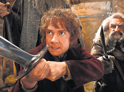 Finding his courage: Bilbo Baggins (Martin Freeman) prepares for battle. The film reunites Freeman with his Sherlock co-star, Benedict Cumberbatch (who voices Smaug).
