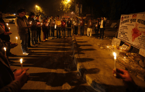 People hold candles as they commemorate last year's gang rape and murder of a young woman in New Delhi, India, Sunday, Dec. 15, 2013. Public anger against crimes against women exploded after a fatal gang-rape of a young woman on a New Delhi bus on Dec.16, 2012. In some ways, the case cracked a cultural taboo surrounding discussion of sexual violence in a country where rape is often viewed as a woman's personal shame to bear. AP photo