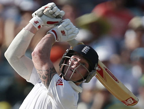 England's Ben Stokes plays a stroke on the fourth day of their Ashes cricket test match against Australia, in Perth, Australia, Monday, Dec. 16, 2013. (AP Photo)