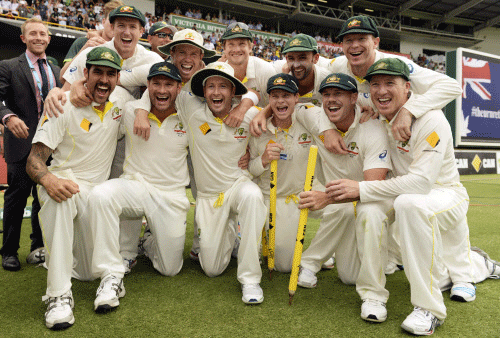 Australia's players celebrate after they won their third Ashes test cricket match against England at the WACA ground in Perth December 17, 2013. REUTERS