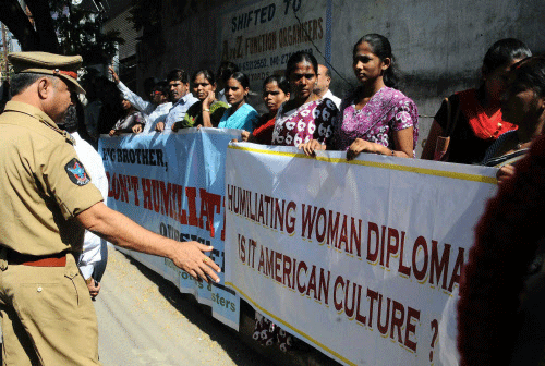 Activists of various organizations staging a silent protest near US Consulate office in Hyderabad on Monday over the diplomatic standoff between India and US over Devyani Khobragade's immunity. PTI
