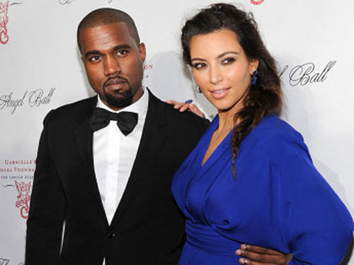 Reality TV star Kim Kardashian with rapper fiance Kanye West. AP File Photo