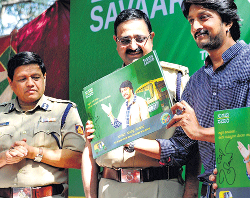 happy commuting: Actor Sudeep releases a poster to mark the launch of 'Sugama Savari'  in the City on Wednesday. Additional Commissioner of Police (Law and Order) Kamal Pant  and Police Commissioner Raghavendra Auradkar are with him. dh Photo