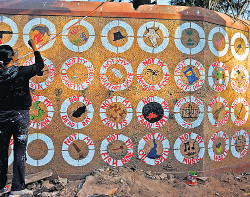 art attack Yelahanka Srishti School of Art students paint the compound of the RBANMS Grounds. DH photo
