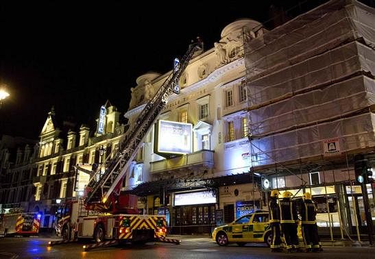 Emergency services look at the roof of the Apollo Theatre on Shaftesbury Avenue after part of the ceiling collapsed in central London December 19, 2013. Reuters