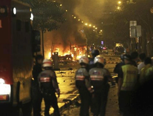 Reuters photo of  the riot in Singapore's Little India district, late December 8, 2013. The riot was sparked by a fatal accident involving an Indian national.