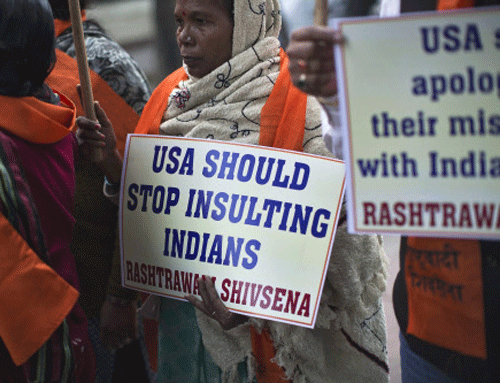 People carry placards during a protest near the U.S. embassy in New Delhi. Reuters photo