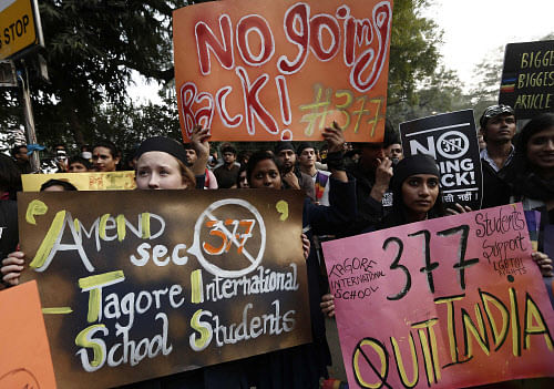 Gay rights activists hold placards during a protest against a verdict by the Supreme Court in New Delhi December 15, 2013. A gay rights activist takes a photograph of herself using her mobile phone during a protest against a verdict by the Supreme Court in New Delhi on December 11, 2013. India's Supreme Court on Wednesday reinstated a ban on gay sex in the world's largest democracy, following a four-year period of decriminalisation that had helped bring homosexuality into the open in the socially conservative country. In 2009 the Delhi High Court ruled unconstitutional a section of the penal code dating back to 1860 that prohibits 'carnal intercourse against the order of nature with any man, woman or animal' and lifted the ban for consenting adults. The Supreme Court threw out that decision, saying only parliament could change Section 377 of the penal code, widely interpreted to refer to homosexual sex. Violation of the law can be punished with up to 10 years in jail. REUTERS