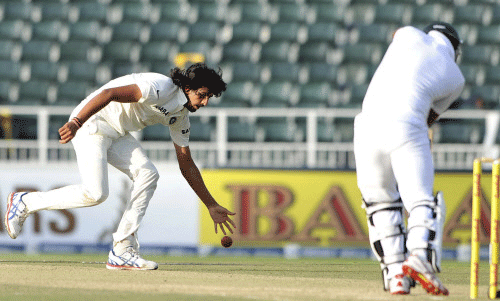 India's Ishant Sharma fields his own bowling during the second day of their cricket test match against South Africa in Johannesburg, December 19, 2013. REUTERS
