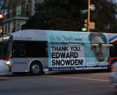 A Washington Metro bus is seen with an Edward Snowden sign on its side panel December 20, 2013. A White House-appointed panel on Wednesday proposed curbs on some key National Security Agency surveillance operations, recommending limits on a program to collect records of billions of telephone calls and new tests before Washington spies on foreign leaders. Among the panel's proposals, made in the wake of revelations by former NSA contractor Edward Snowden, the most contentious may be its recommendation that the eavesdropping agency halt bulk collection of the phone call records, known as 'metadata.' REUTERS