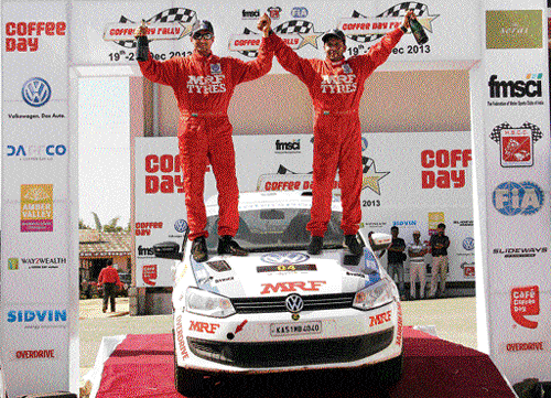 signing off on a high: Arjun Rao (left) and navigator Satish Rajagopal are over the moon after clinching the overall title in the Coffee Day Rally in Chikmagalur on Saturday.