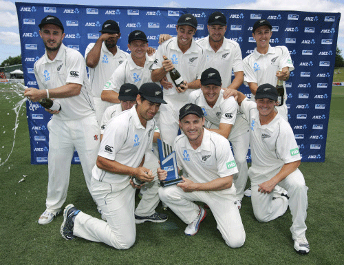New Zealand celebrate their series win over the West Indies in the third cricket test, at Seddon Park, in Hamilton, New Zealand, Sunday, Dec. 22, 2013. AP photo