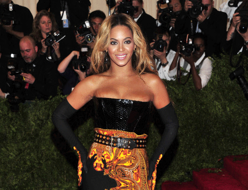 FILE - This May 6, 2013 file photo shows singer Beyonce at The Metropolitan Museum of Art's Costume Institute benefit in New York. Beyonce has released her new album in an unconventional way: She announced and dropped it on the same day. The singer released 'Beyonce' exclusively on iTunes early Friday, Dec. 13.  AP