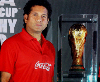Former Indian Cricketer Sachin Tendulkar with the FIFA World Cup Trophy during the World tour of the trophy, in Kolkata on Sunday. PTI Photo