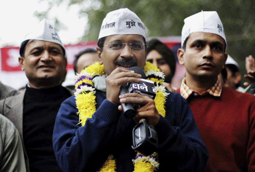 Aam Aadmi Party (AAP), or Common Man's Party leader Arvind Kejriwal speaks at a public meeting in New Delhi, India, Sunday, Dec. 22, 2013. The group, led by former tax official Kejriwal, said Sunday that the final announcement on whether it will form a government in Delhi will be made Monday. The new political party played spoiler in the Delhi state assembly elections pushing the ruling Congress party into third place, and promises to tap the deep vein of dissatisfaction that has gripped Delhi residents, particularly over corruption and the soaring cost of living. AP photo