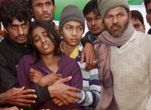 RPT..Gurgaon: Wailing family members of Subedar K P Singh, Indian peacekeeper killed by the rebels in South Sudan's troubled Jonglei state, during his funeral procession at Bhondsi village in Gurgaon on Monday. PTI Photo