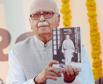 Senior BJP leader L K Advani exhibits a book on the life of Sardar Vallabh Bhai Patel during the Run for Unity event, in Ahmedabad on Sunday. PTI Photo