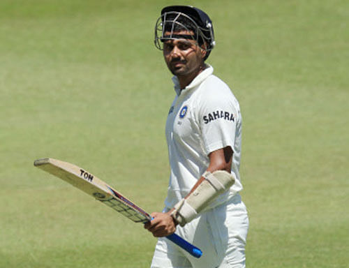 Murali Vijay leaves the field after dismissed by South Africa's bowler Dale Steyn, for 97 runs during second day of their cricket test match at Kingsmead stadium, Durban, South Africa, Friday, Dec. 27, 2013. (AP Photo)