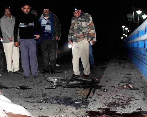 Police officers at the site of a blast in Jalpaiguri on Thrusday. PTI Photo