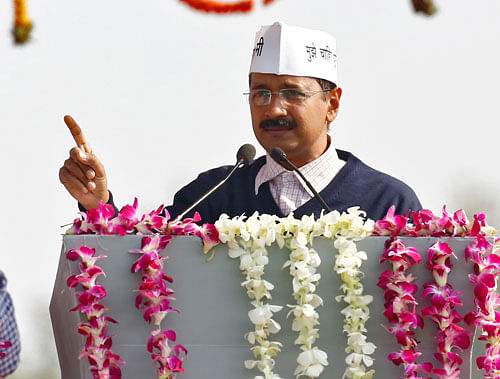 Kejriwal addressing his supporters after taking oath as the new chief minister of Delhi during a swearing-in ceremony at Ramlila grounds in New Delhi December 28, 2013. REUTERS