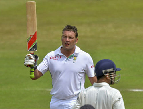 South Africa's Jacques Kallis celebrates scoring a half century during the third day of the second cricket test match against India in Durban, December 28, 2013. REUTERS