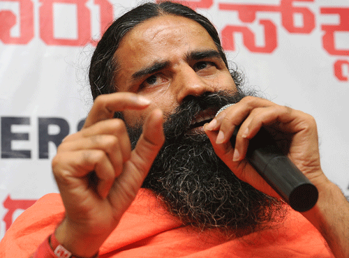 Yoga Guru Baba Ramdev will campaign against UPA chairperson Sonia Gandhi and Congress vice president Rahul Gandhi in the forthcoming Lok Sabha polls. DH File Photo.