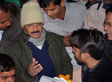 Delhi Chief Minister Arvind Kejriwal meets people during Janta Darbar at his residence in Kaushambi in Ghaziabad on Sunday. PTI Photo