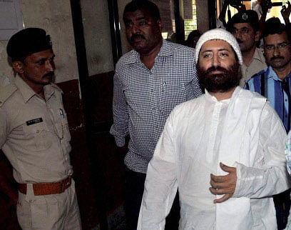 Narayan Sai, accused in a rape case, being produced in court in Surat. PTI photo