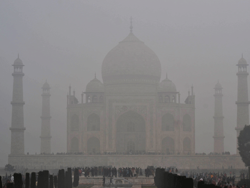 Fog envelops the monument Taj Mahal in Agra, India. At 1.4 degrees Celsius, Taj city was the coldest in Uttar Pradesh Sunday night, six degrees below normal.  AP
