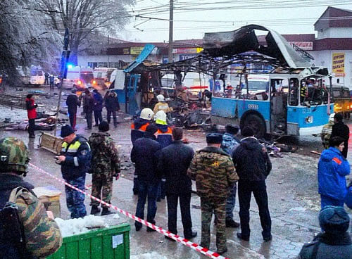 Members of the emergency services work at the site of a blast on a trolleybus in Volgograd in this December 30, 2013 handout photo. The bomb blast ripped a trolleybus apart in Volgograd on Monday, killing at least 10 people in the second deadly attack in the southern city in two days and raising fears of further violence as Russia prepares to host the Winter Olympics. REUTERS