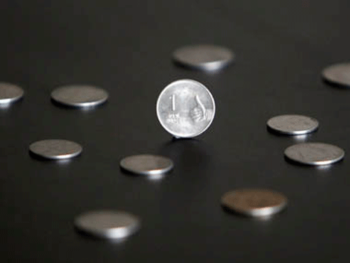 The rupee fell six paise to 61.91 against the dollar today on month-end demand for the US currency from importers amid a sluggish equity market. Reuters file photo