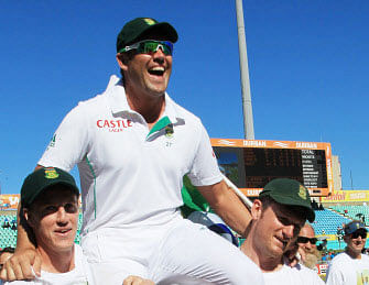 South Africa's bowler Jacques Kallis is carried by teammates after he retired from Test cricket at end of the fifth and final day of their cricket test match against India at Kingsmead stadium, Durban, South Africa, Monday, Dec. 30, 2013. South Africa beat India by 10 wickets. AP