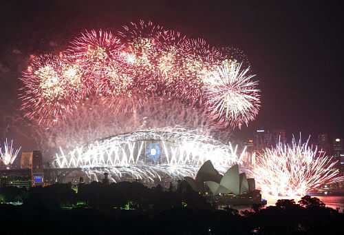 Fireworks explode over Sydney Harbour at midnight, ushering in the new year in Sydney. Reuters.