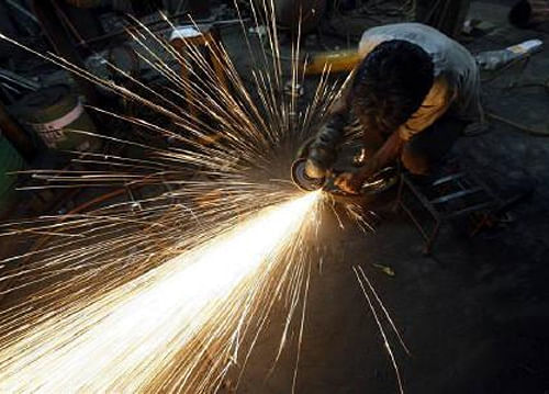 India's manufacturing sector decelerated marginally in December as a slowdown in domestic order flows led to slower output growth, an HSBC survey said today. Reuters File Photo.