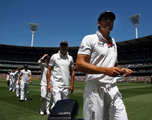 England's captain Alastair Cook (front) and his teammates walk off the field after losing the fourth Ashes cricket test against Australia at the Melbourne cricket ground December 29, 2013. Australia completed a dominant eight-wicket victory in the fourth Ashes test before tea on day four, swatting away a toothless England at the Melbourne Cricket Ground on Sunday to take a 4-0 lead in the five-test series. REUTERS