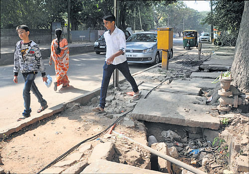 People are forced to walk on the road because of the sad state of footpaths on  Richmond Road near Hosmat Hospital.