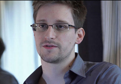 FILE - This June 9, 2013 file photo provided by The Guardian Newspaper in London shows National Security Agency leaker Edward Snowden, in Hong Kong. Snowden says his 'mission's already accomplished' after leaking NSA secrets that have caused a reassessment of U.S. surveillance policies.  AP