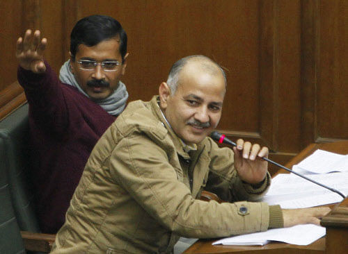 Delhi Chief Minister Arvind Kejriwal and PWD Minister, Manish Sisodia during the confidence motion in Delhi Legislative Assembly in New Delhi on Thursday. PTI Photo