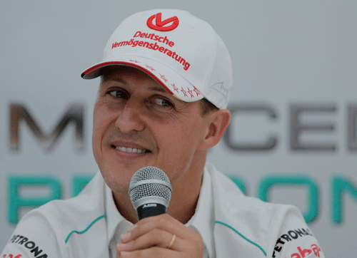 Michael Schumacher announces his retirement from Formula One at the end of the 2012 season during a press conference at the Suzuka Circuit venue for the Japanese Formula One Grand Prix in Suzuka, Japan, in this Thursday, Oct. 4, 2012 file photo. Seven-time Formula One champion Michael Schumacher was hospitalized with a head injury Sunday Dec. 29 2013, after a skiing accident in the French Alps, French authorities and his manager said. The French Mountain Gendarmerie said Schumacher was wearing a helmet when he had a hard fall at the Meribel resort and that he sustained a 'relatively serious' head injury. AP