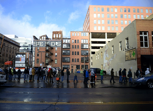 Customers wait in line, which was more than 300 deep by 10 a.m., on the first day of retail marijuana sales at LoDo Wellness in Denver Wednesday Jan. 1, 2014. Customers can legally purchase marijuana for recreation use in Colorado. AP