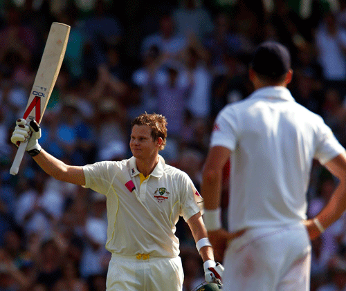 Australia's Steve Smith (L) celebrates reaching his century as England's Kevin Pietersen looks on during the first day of the fifth Ashes cricket test at the Sydney cricket ground January 3, 2014. REUTERS