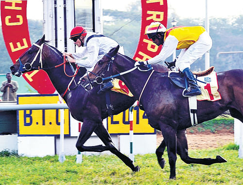 final flourish: L Beuzelin powers Agostini (left) to victory in the Chief Minister's Trophy on Friday. DH Photo