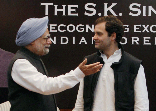 File......Prime Minister Manmohan Singh and Rahul Gandhi at an award function in New Delhi. Prime Minister Singh announced that he is not going to be the candidate for prime ministership again. 'Rahul Gandhi has outstanding credentials to be PM candidate. PTI Photo