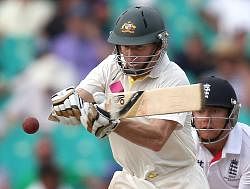 Australia's Chris Rogers, left, drives the ball in front of England's Jonny Bairstow during their Ashes cricket test match at the Sydney Cricket Ground in Sydney, Saturday, Jan. 4, 2014. Australia are closing in on a 5-0 clean sweep of the Ashes after the second day's play against England in the fifth and final Test at the Sydney Cricket Ground (SCG) here Saturday. AP