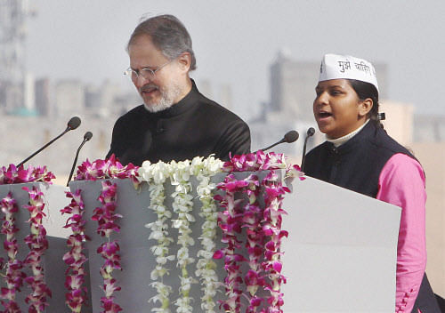 File photo of Lieutenant Governor of Delhi Najeeb Jung administering the oath of office and secrecy to AAP leader Rakhi Birla as cabinet minister in New Delhi. PTI