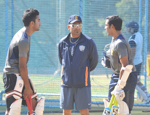 Karnataka's opening pair KL rahul and Robin Uttappa taking tips from their coach J Arun Kumar during their nets practice session on the eve of the quaterfinal match of Ranji cricket tournament at Chinnawamy stadium in Bangalore on Tuesday. DH PHOTO