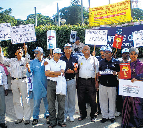 Ravindra (centre in white) at an anti-corruption protest. DHNS