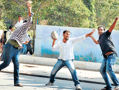 up in arms: Pro-Telangana students of Osmania University during a clash with the police  after introduction of the Telangana Bill in the Assembly in Hyderabad on Tuesday. pti