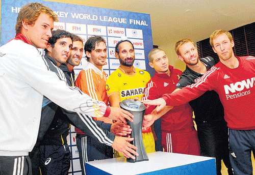 who will lift it last? (From left) Germany's Oliver Korn, Argentina's Lucas Rey, Australia's Mark Knowles, Netherlands' Robert van der Horst, India's Sardar Singh, Belgium's John-John Dohmen, New Zealand's Dean Couzins, England's Barry Middleton -- captains of their respective sides -- unveil the Hero Hockey World League Final trophy on Wednesday.